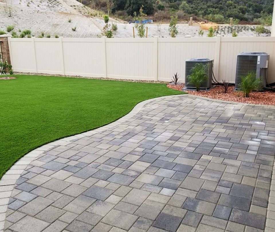 Interlocking stone pavers and turf