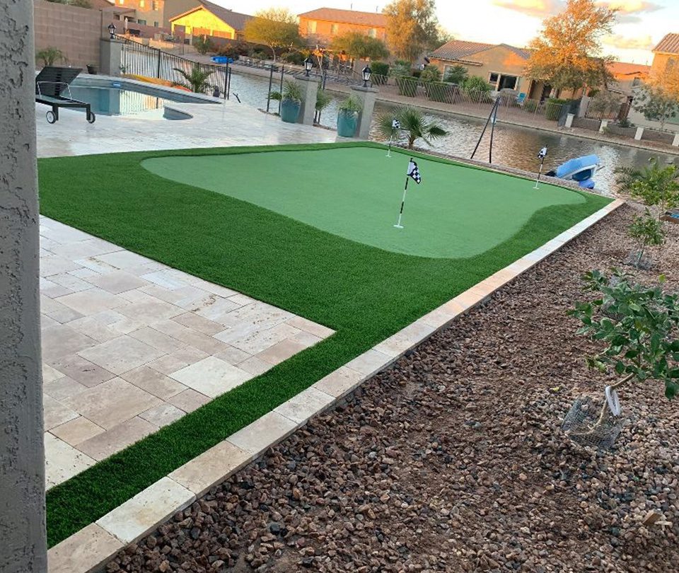 Water-side pool and artificial turf putting range