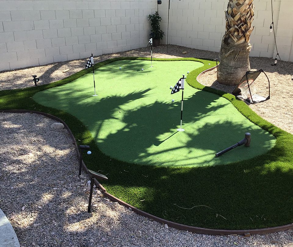 Three Hole putting range and palm tree