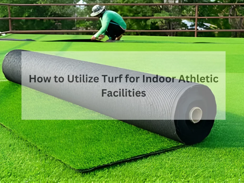 roll of artificial turf being installed on a flat surface with a person in the background working on the turf installation, with the text 'How to Utilize Turf for Indoor Athletic Facilities' overlaid